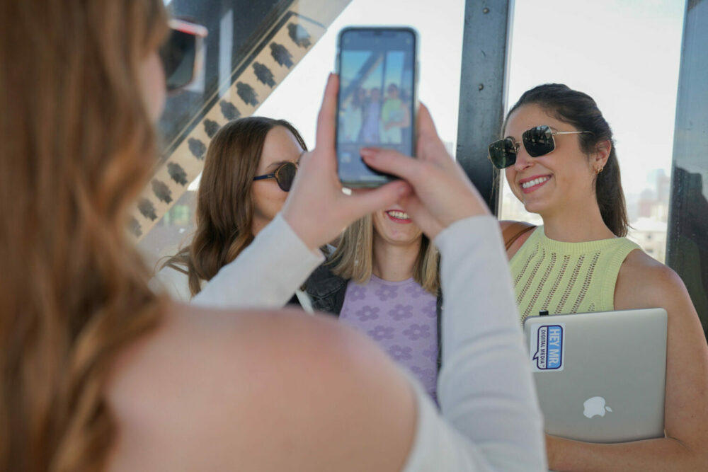 Three women posing for an iPhone Photo